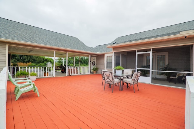 wooden terrace with a sunroom