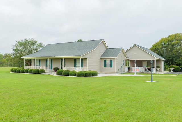 ranch-style home featuring a porch and a front lawn