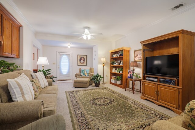 living room with crown molding and light carpet