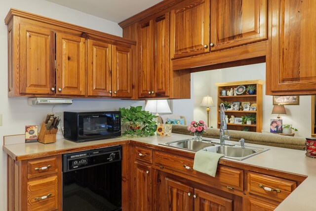 kitchen featuring black appliances and sink