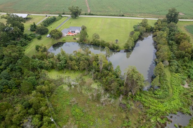 birds eye view of property featuring a rural view and a water view