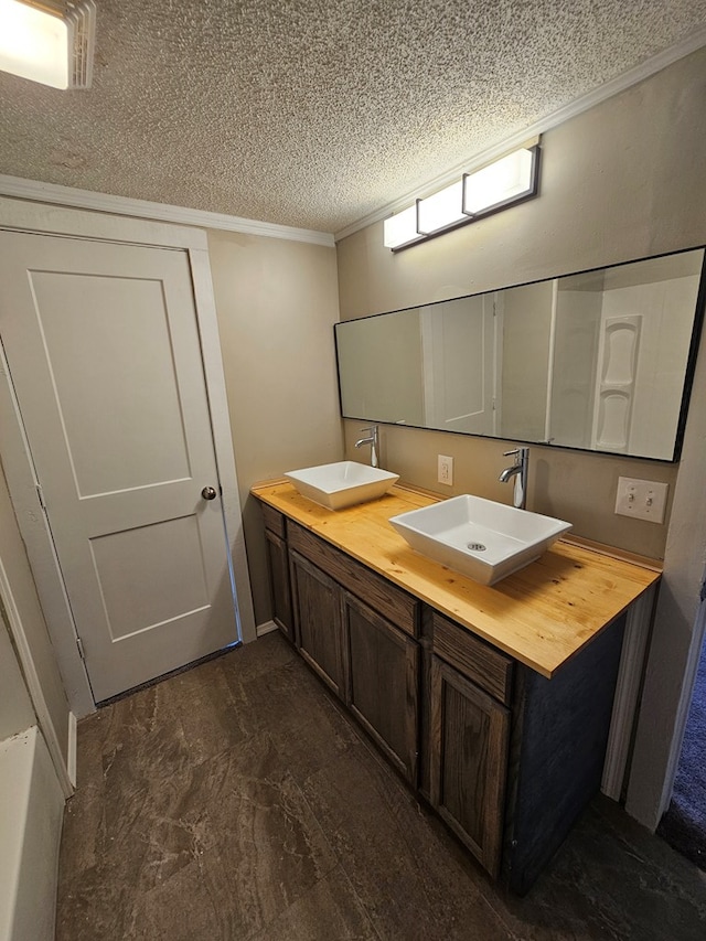 2105 N Troup St, Valdosta, GA 31602 - full bath featuring a textured ceiling, double vanity, and ornamental molding