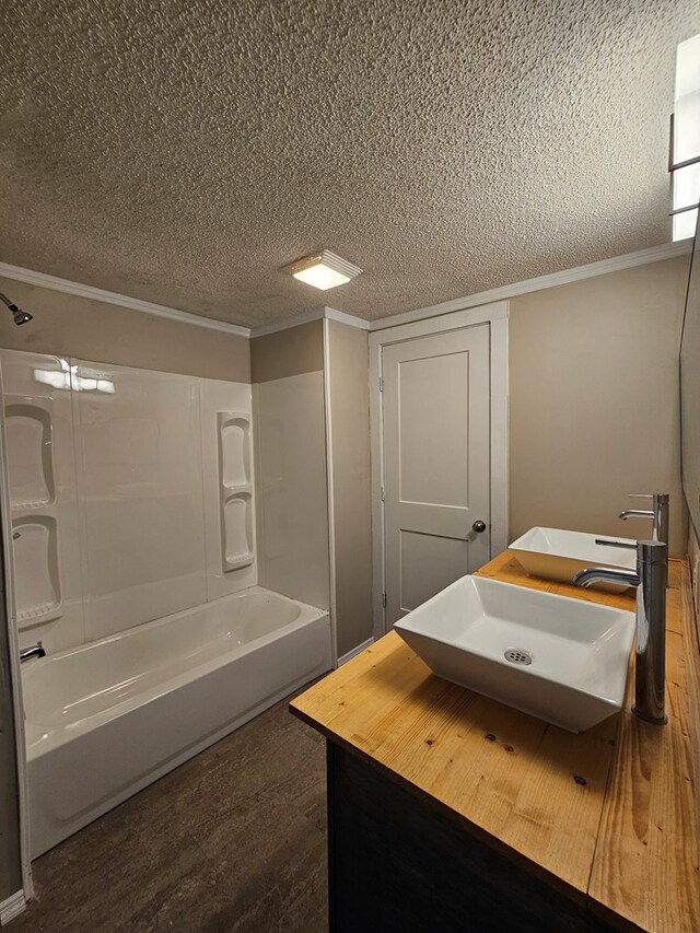 2105 N Troup St, Valdosta, GA 31602 - full bath featuring a textured ceiling, shower / bathtub combination, crown molding, and vanity
