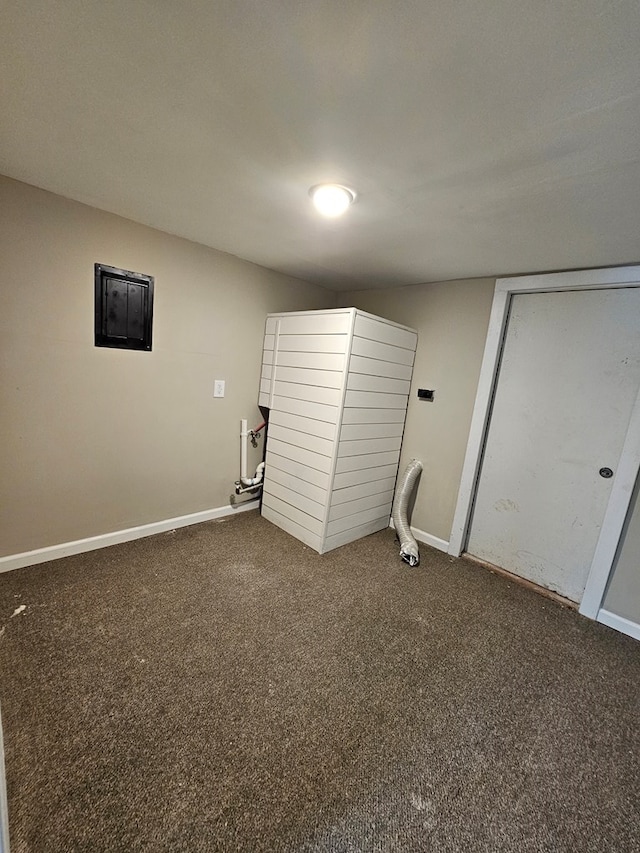 2105 N Troup St, Valdosta, GA 31602 - laundry room featuring dark carpet and baseboards