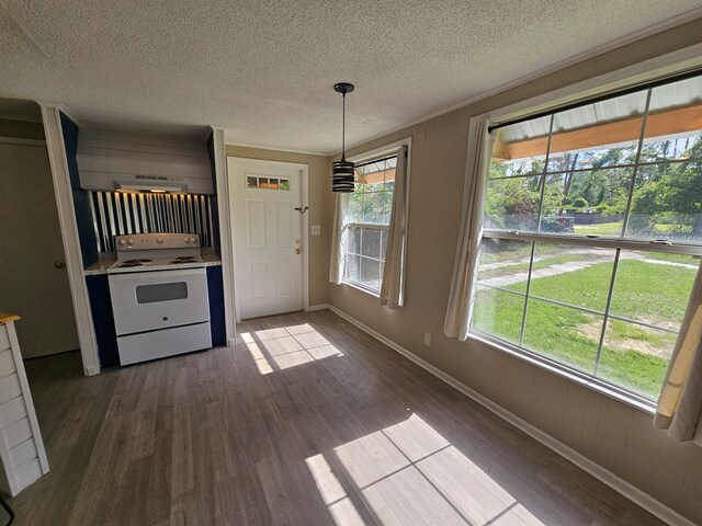 2105 N Troup St, Valdosta, GA 31602 - unfurnished dining area with dark wood finished floors and a textured ceiling