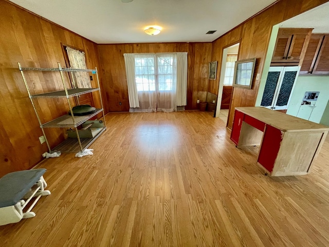 interior space featuring hardwood / wood-style floors and wooden walls