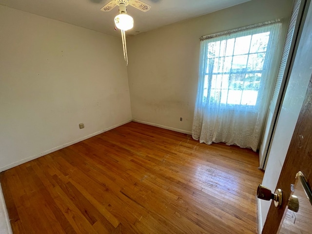 spare room with ceiling fan and light hardwood / wood-style flooring