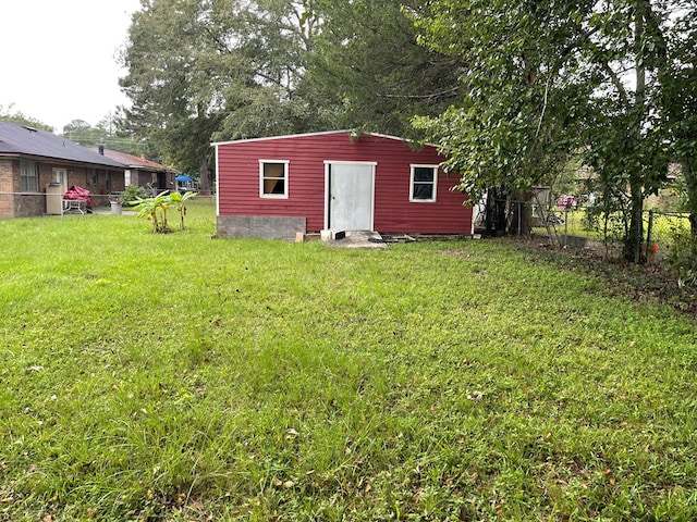 view of outdoor structure featuring a yard