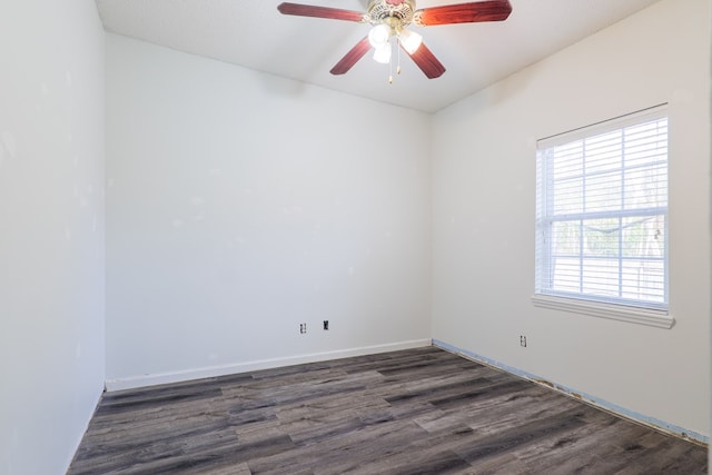 unfurnished room with ceiling fan and dark hardwood / wood-style floors