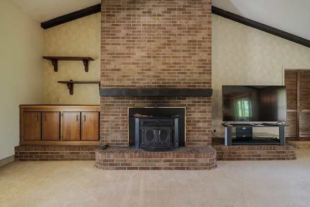 unfurnished living room featuring carpet flooring, high vaulted ceiling, baseboards, and a wood stove