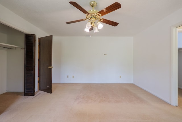 unfurnished bedroom with a ceiling fan, a closet, and carpet