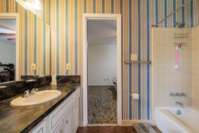 full bathroom with vanity, bathtub / shower combination, wallpapered walls, and tile patterned floors