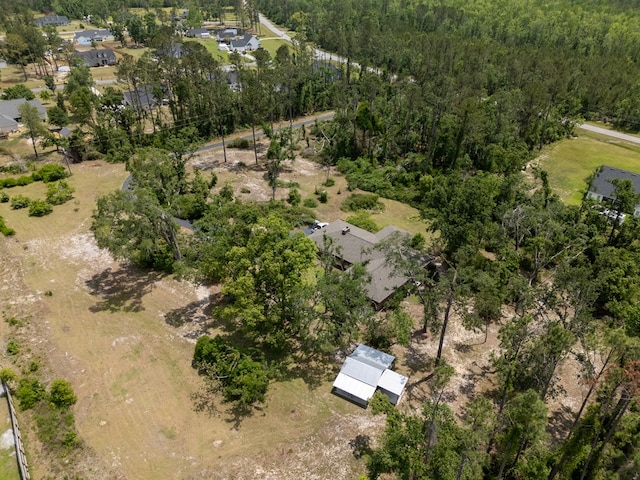 drone / aerial view featuring a view of trees