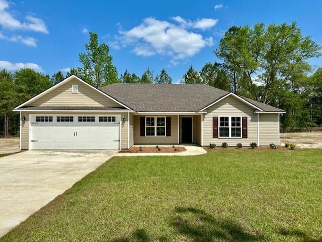 ranch-style home with a front yard and a garage