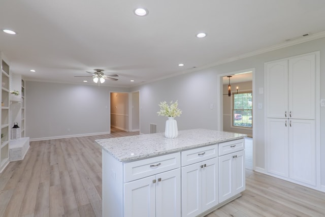 kitchen featuring recessed lighting, white cabinets, ceiling fan with notable chandelier, and visible vents