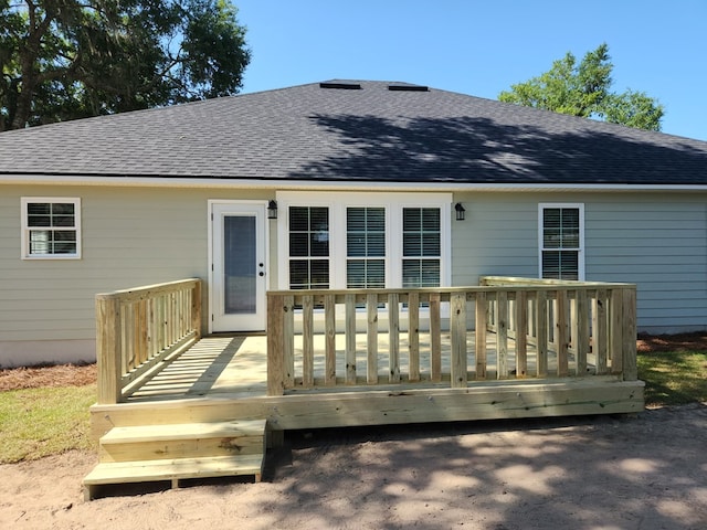 back of house featuring a wooden deck