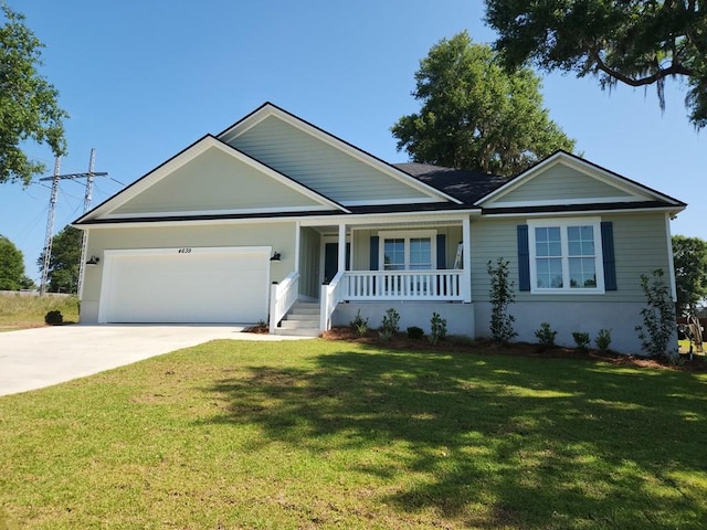 ranch-style home with a porch, a garage, and a front lawn