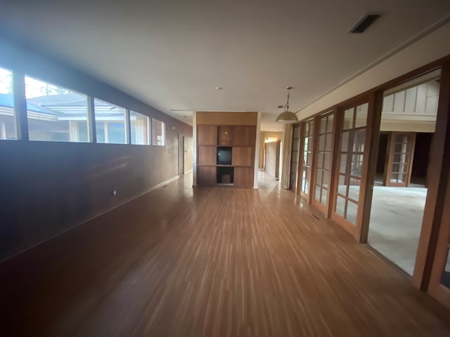 unfurnished living room with wood-type flooring