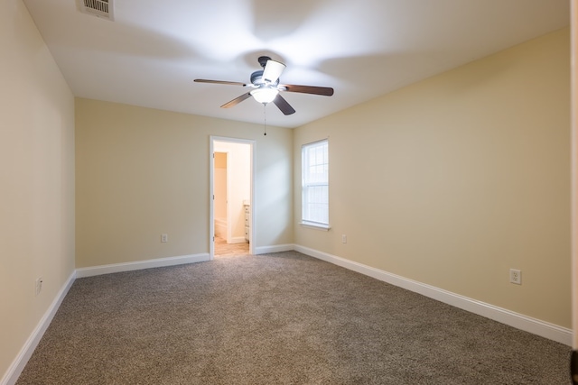 unfurnished room with carpet flooring and ceiling fan