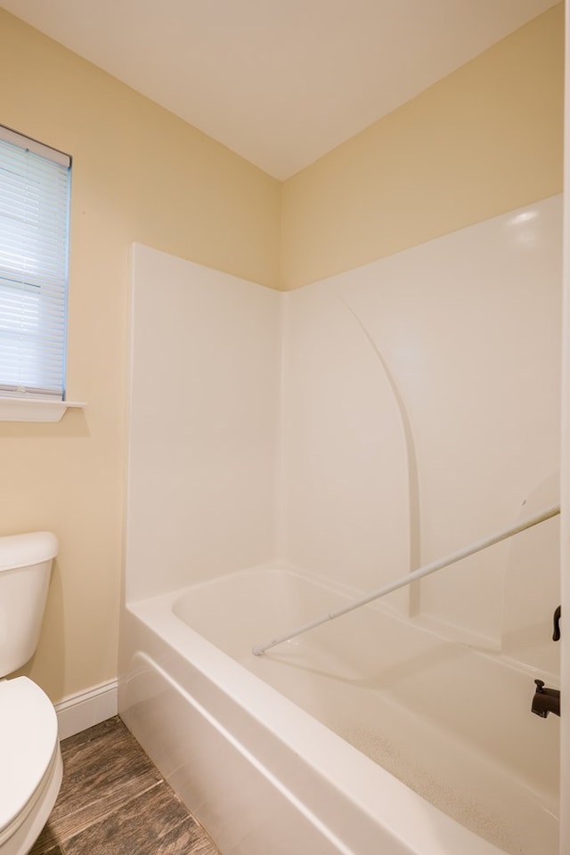 bathroom featuring hardwood / wood-style floors and toilet