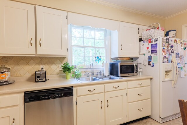 303 Breckenridge Dr, Valdosta, GA 31605 - kitchen with appliances with stainless steel finishes, crown molding, backsplash, white cabinetry, and light countertops