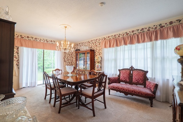 303 Breckenridge Dr, Valdosta, GA 31605 - dining area with light carpet, a chandelier, and a textured ceiling