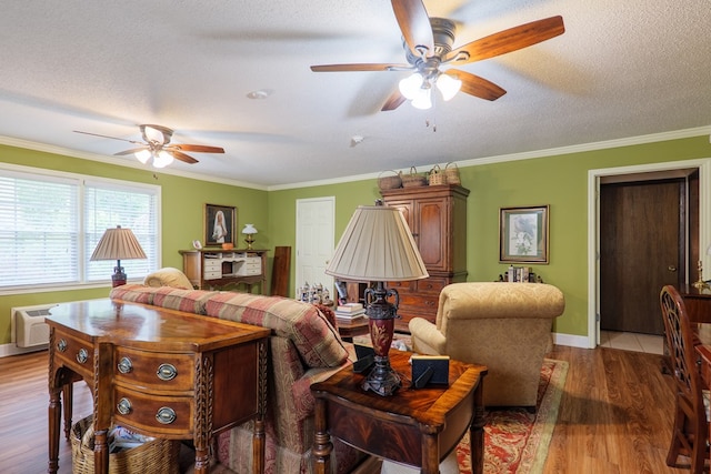 303 Breckenridge Dr, Valdosta, GA 31605 - living room featuring ceiling fan, light wood finished floors, ornamental molding, and a textured ceiling