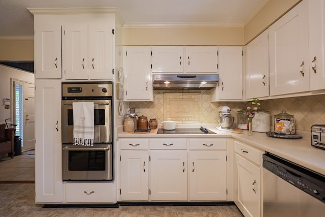 303 Breckenridge Dr, Valdosta, GA 31605 - kitchen with appliances with stainless steel finishes, under cabinet range hood, ornamental molding, light countertops, and white cabinets
