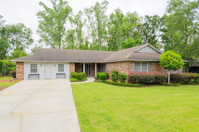 303 Breckenridge Dr, Valdosta, GA 31605 - view of front of home featuring concrete driveway, a front lawn, roof with shingles, and brick siding