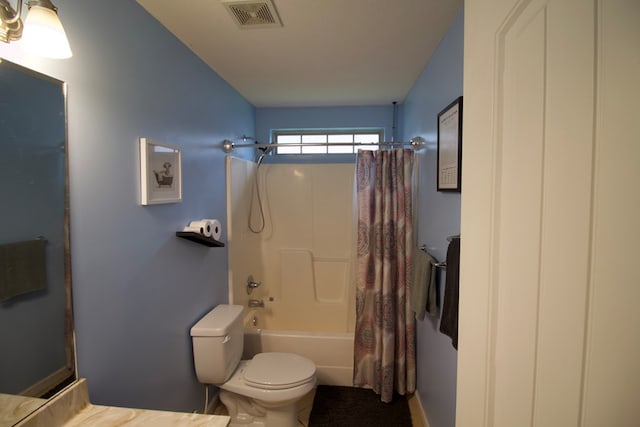 full bathroom with toilet, visible vents, and shower / tub combo with curtain