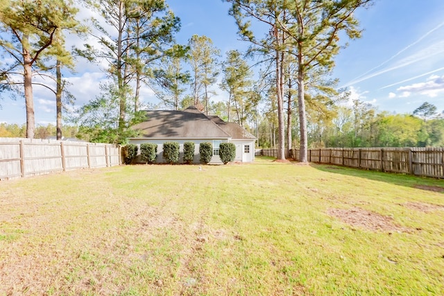 view of yard with a fenced backyard