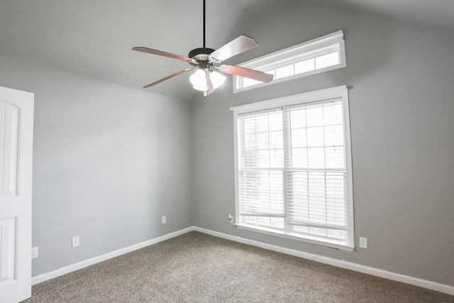 unfurnished room with plenty of natural light, carpet floors, and ceiling fan