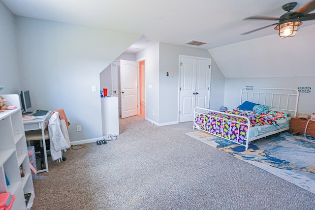 bedroom featuring carpet flooring, visible vents, baseboards, a ceiling fan, and lofted ceiling