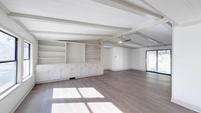 unfurnished room featuring light wood-style floors, a ceiling fan, lofted ceiling with beams, and baseboards