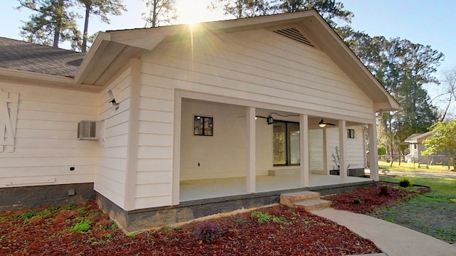 view of property exterior featuring ceiling fan and roof with shingles