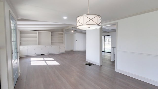 unfurnished room featuring wood finished floors, baseboards, recessed lighting, ornamental molding, and vaulted ceiling