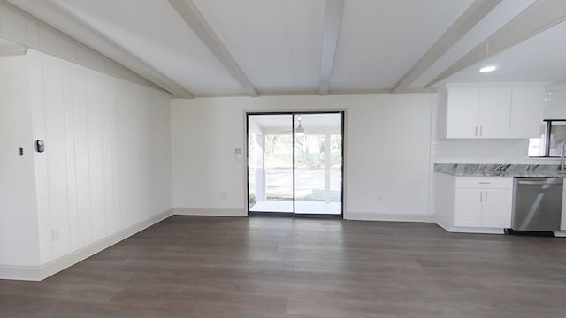 interior space with stainless steel dishwasher, beam ceiling, dark wood-style floors, and white cabinetry