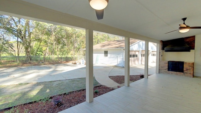 view of patio / terrace featuring a ceiling fan and fence