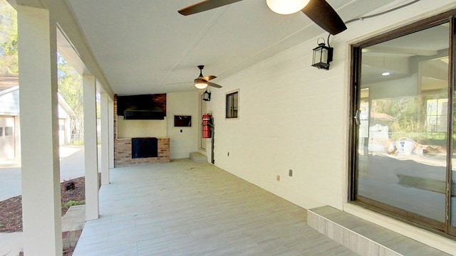 view of patio featuring ceiling fan