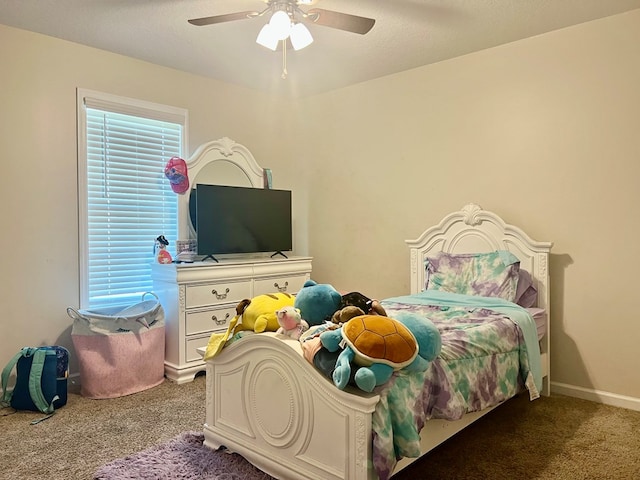 carpeted bedroom with baseboards, ceiling fan, and multiple windows