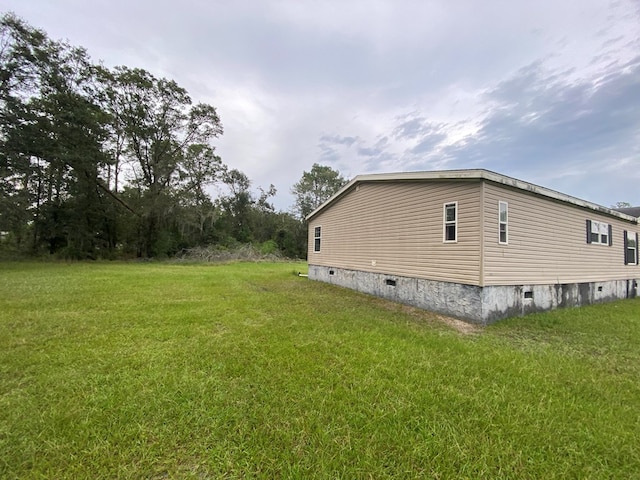 view of property exterior featuring a lawn