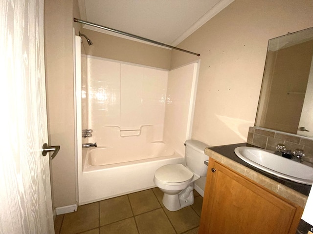 full bathroom with tile patterned floors, crown molding,  shower combination, toilet, and vanity