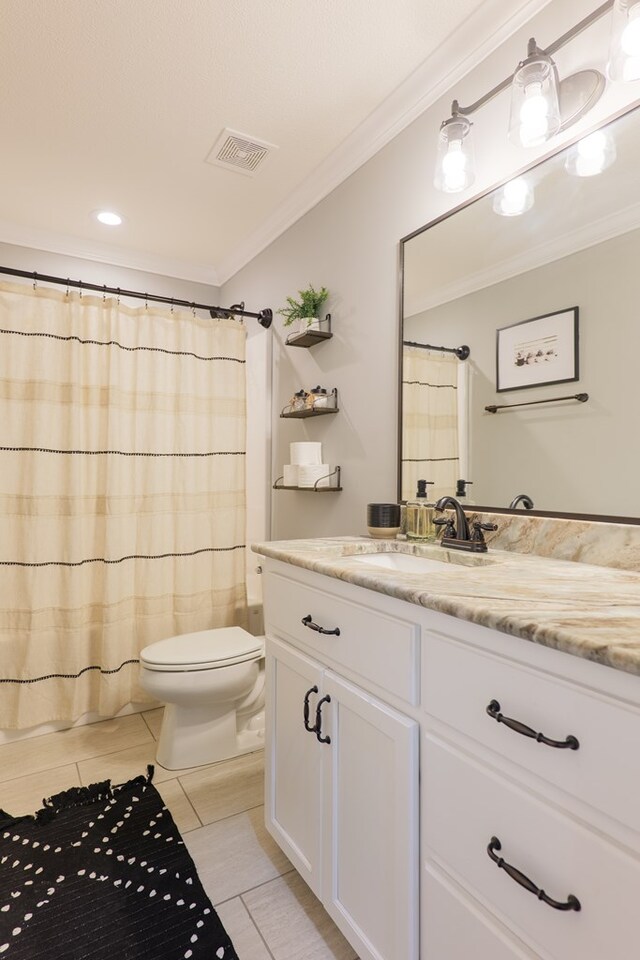 bathroom featuring visible vents, toilet, a shower with curtain, crown molding, and vanity