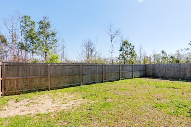 view of yard with a fenced backyard