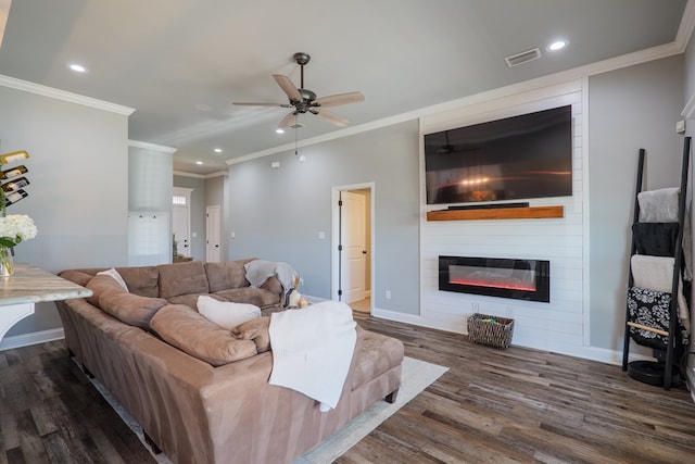 living room with dark wood-type flooring, a fireplace, visible vents, and baseboards