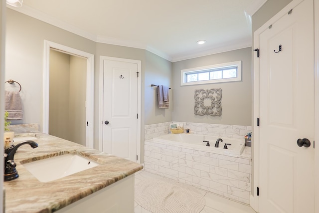 full bathroom with vanity, a garden tub, and crown molding