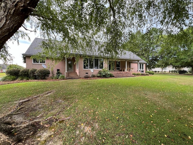 ranch-style home with a front lawn