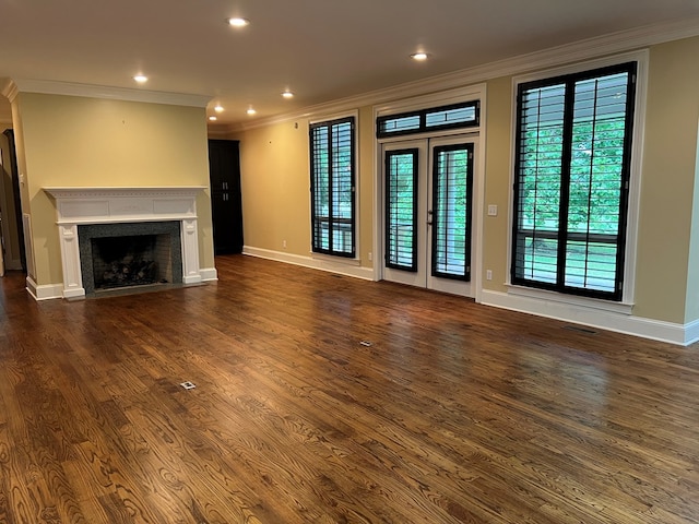 unfurnished living room featuring dark hardwood / wood-style floors and crown molding