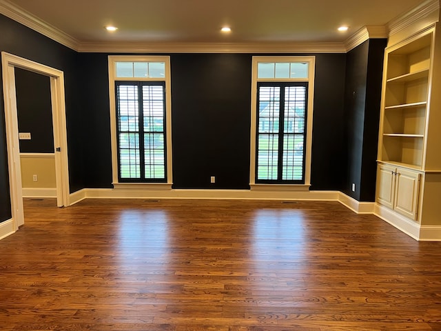 unfurnished room featuring dark hardwood / wood-style floors, a wealth of natural light, and french doors