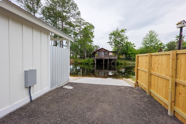 view of yard with a patio area and a water view